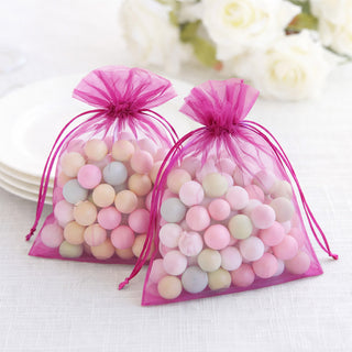 Colorful candy-filled organza bags for party favors.