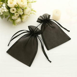 Black organza gift bags with drawstrings, perfect for weddings and events.