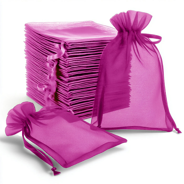 Purple organza gift bags stacked and displayed on a white background