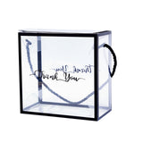 Clear gift bag with black handles and "Thank You" text. #whtbkgd