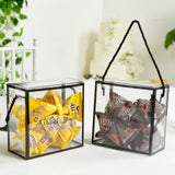 Decorative gift boxes with assorted candies in yellow and brown.