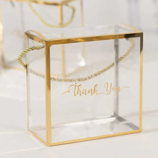 <span style="background-color:transparent;color:#000000;">Elegant Clear Favor Boxes With Gold Trim</span>