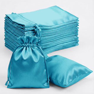 Set of turquoise satin bags with drawstring closure for storage or gifting