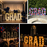 Oversized illuminated marquee letters used indoors for a romantic proposal and party décor display