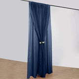 Navy blue curtain draped elegantly in a studio setting
