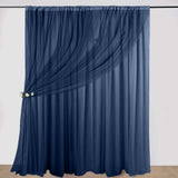 Navy blue sheer curtain with drape and floral tieback