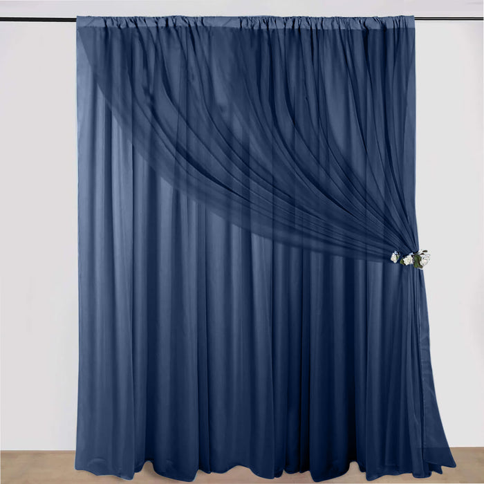 Navy sheer curtain draped elegantly with a decorative tieback.
