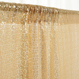 Gold sequin fabric draped elegantly, shimmering with light.