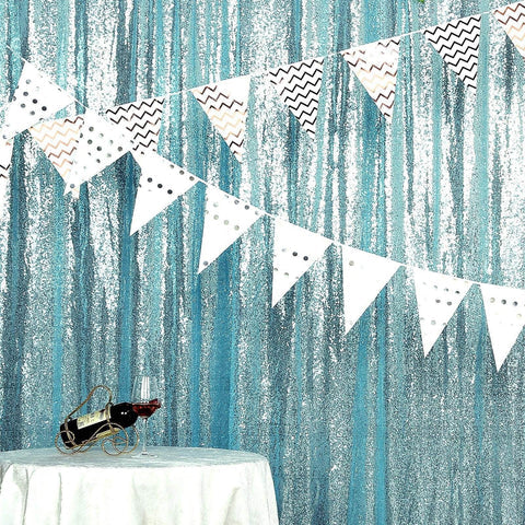 Blue sequin backdrop with bunting flags