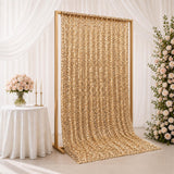 Gold sequin wedding backdrop with floral decor and draped white curtains