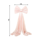 Large pink satin bow with flowing tails, perfect for decorations.