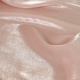 Pink satin fabric with a shimmering texture.