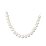 White pearl necklace on a white background, elegant beaded jewelry necklace