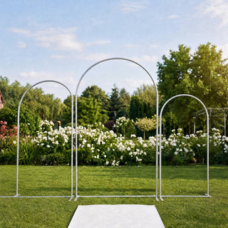 Garden wedding arch backdrop with white aisle runner on a green lawn