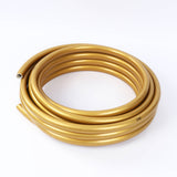 Coiled gold flexible hose tube on white background#whtbkgd
