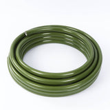 Coiled green PVC hose on white background#whtbkgd