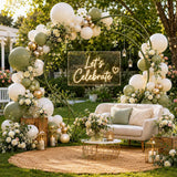 Elegant outdoor celebration setup with balloons, flowers, and neon “Let’s Celebrate” sign
