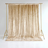 Gold velvet backdrop on a stand for photography