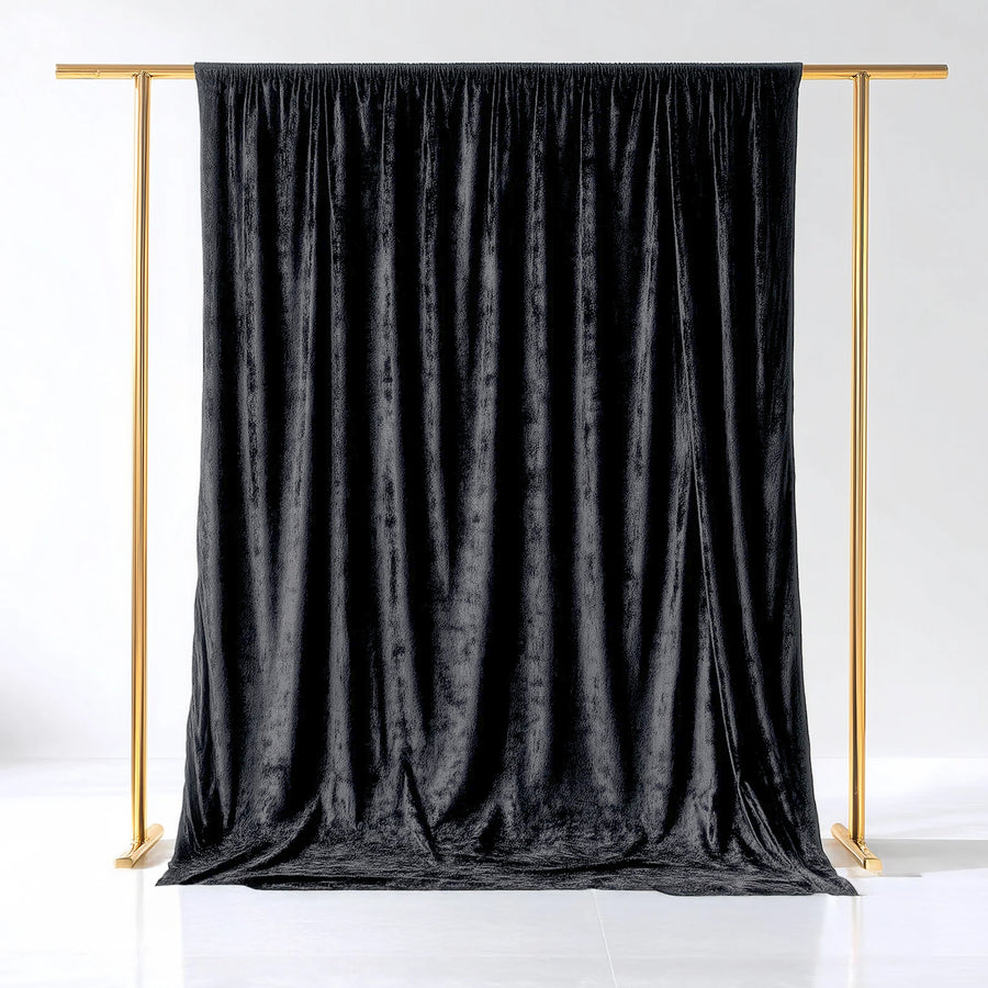 Black velvet backdrop with gold stand for photography.
