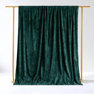 Emerald green velvet backdrop on a gold frame