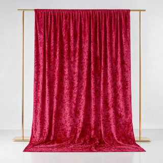 Red velvet backdrop draped elegantly on a gold frame.