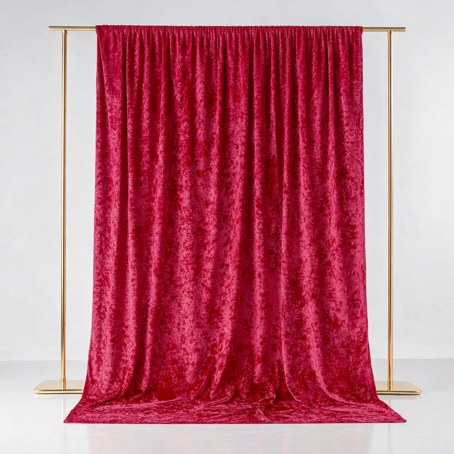 Red velvet backdrop draped elegantly on a gold frame.