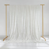 White velvet backdrop draped on a gold stand for photography