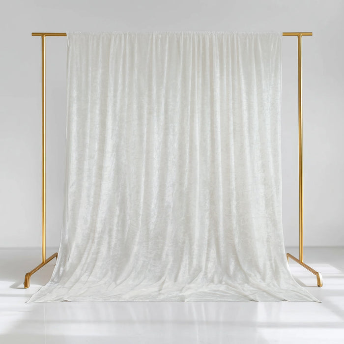 White velvet backdrop draped on a gold stand for photography
