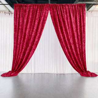 Red velvet curtains draped elegantly in a studio setting