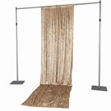 Gold velvet photo backdrop stand with draped curtain on adjustable frame