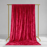 Red velvet curtain on gold backdrop stand, studio product display