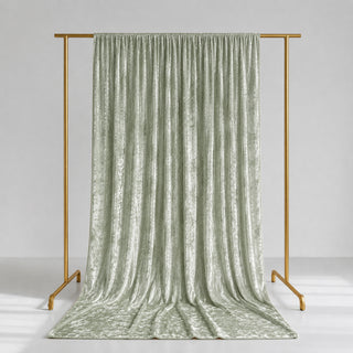 Sage green velvet curtains on gold clothing rack, elegant studio backdrop