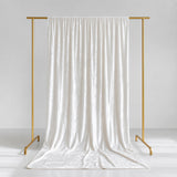 Elegant white satin curtain on gold garment rack, minimalist studio backdrop