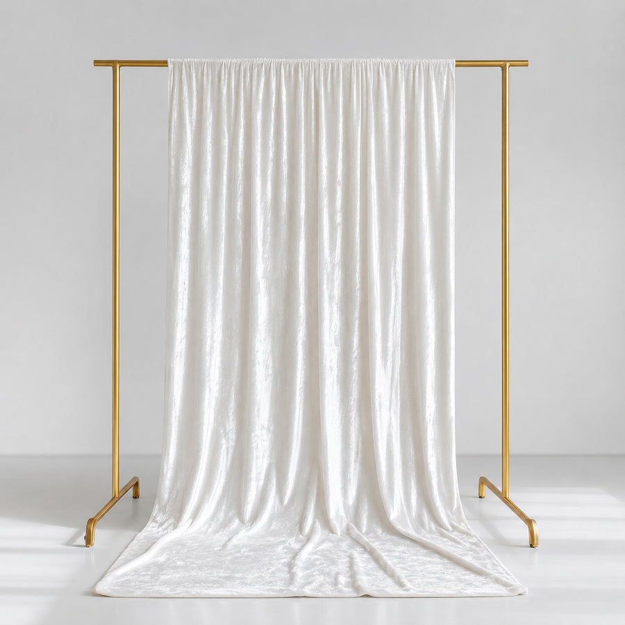 Elegant white satin curtain on gold garment rack, minimalist studio backdrop