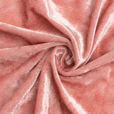 Rose pink velvet fabric texture with elegant swirling folds