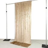Gold sequin backdrop curtain on adjustable display stand