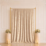 Gold sequin backdrop with floral pedestals and candle decor