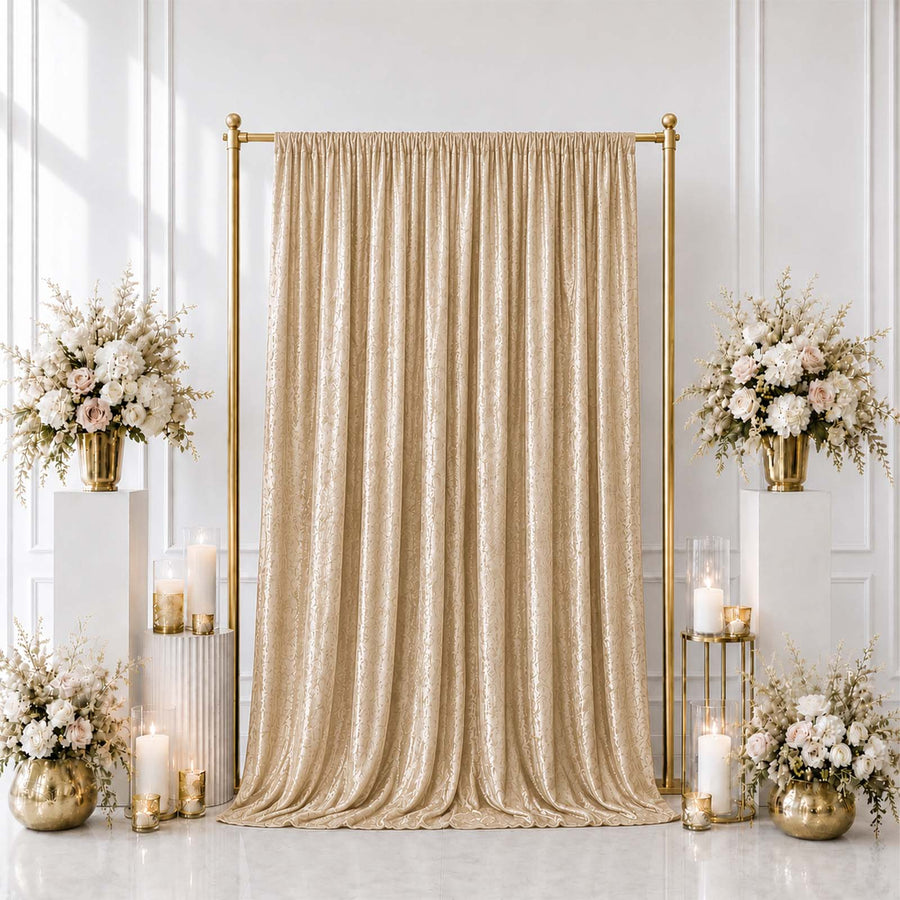 Elegant gold wedding backdrop with champagne curtain and white floral arrangements