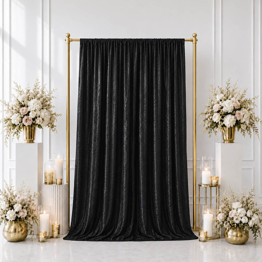 Black velvet backdrop with gold frame and floral wedding decor