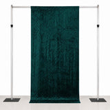 Green velvet photography backdrop on adjustable metal stand frame
