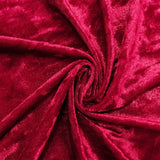 Close-up of luxurious red velvet fabric with swirling folds#whtbkgd