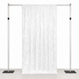 Adjustable metal backdrop stand with white curtain drape for events