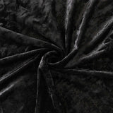 Black velvet fabric texture with soft folds and swirls#whtbkgd