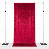 Red sequin backdrop curtain on adjustable pipe and drape stand