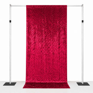 Red sequin backdrop curtain on adjustable pipe and drape stand