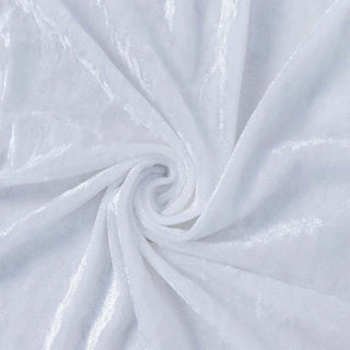 White textured fabric swirled into a soft spiral pattern#whtbkgd