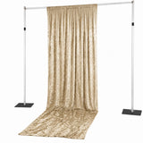 Gold velvet curtain backdrop on adjustable stand for events and photography
