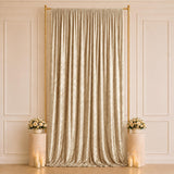 Elegant champagne curtain backdrop with gold frame and floral candle decor