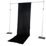 Black pipe and drape backdrop stand with curtain and floor runner