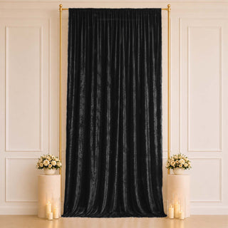 Elegant black velvet curtain backdrop with gold frame and floral decor
